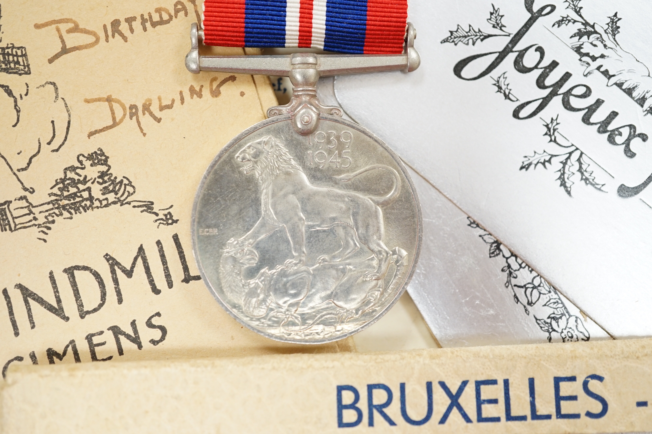 An RAF silver mug, and framed drawing of a map of Belgium and surrounding countries relating to 83rd Group Main HQ, Tactical Air Force 1944-45 together with four WWII medals in the original card, issue box; the Defence M